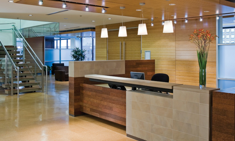 Desk and lobby area with wall paneling and flooring at Cervantes/Geronimo