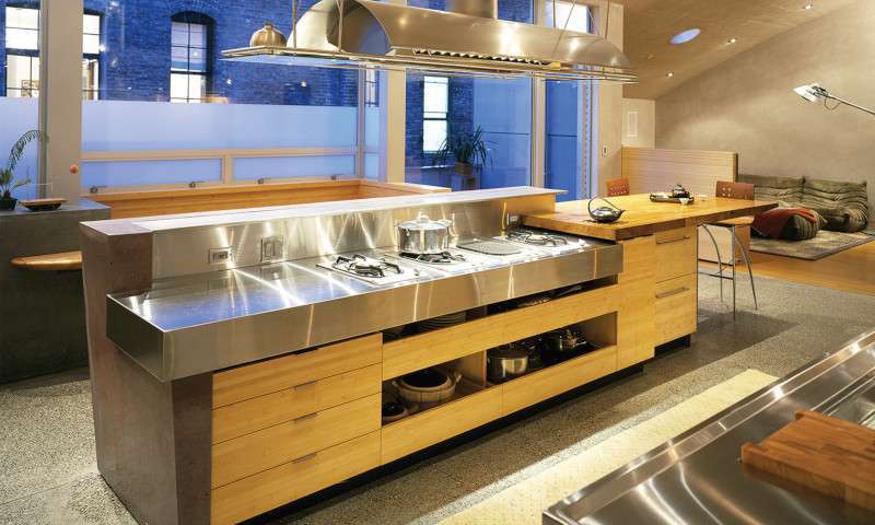 Kitchen at Natoma Loft featuring natural flat grain material for cabinetry